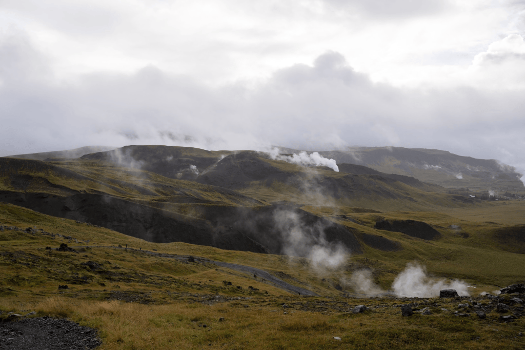 Geothermal vents steam in the distance